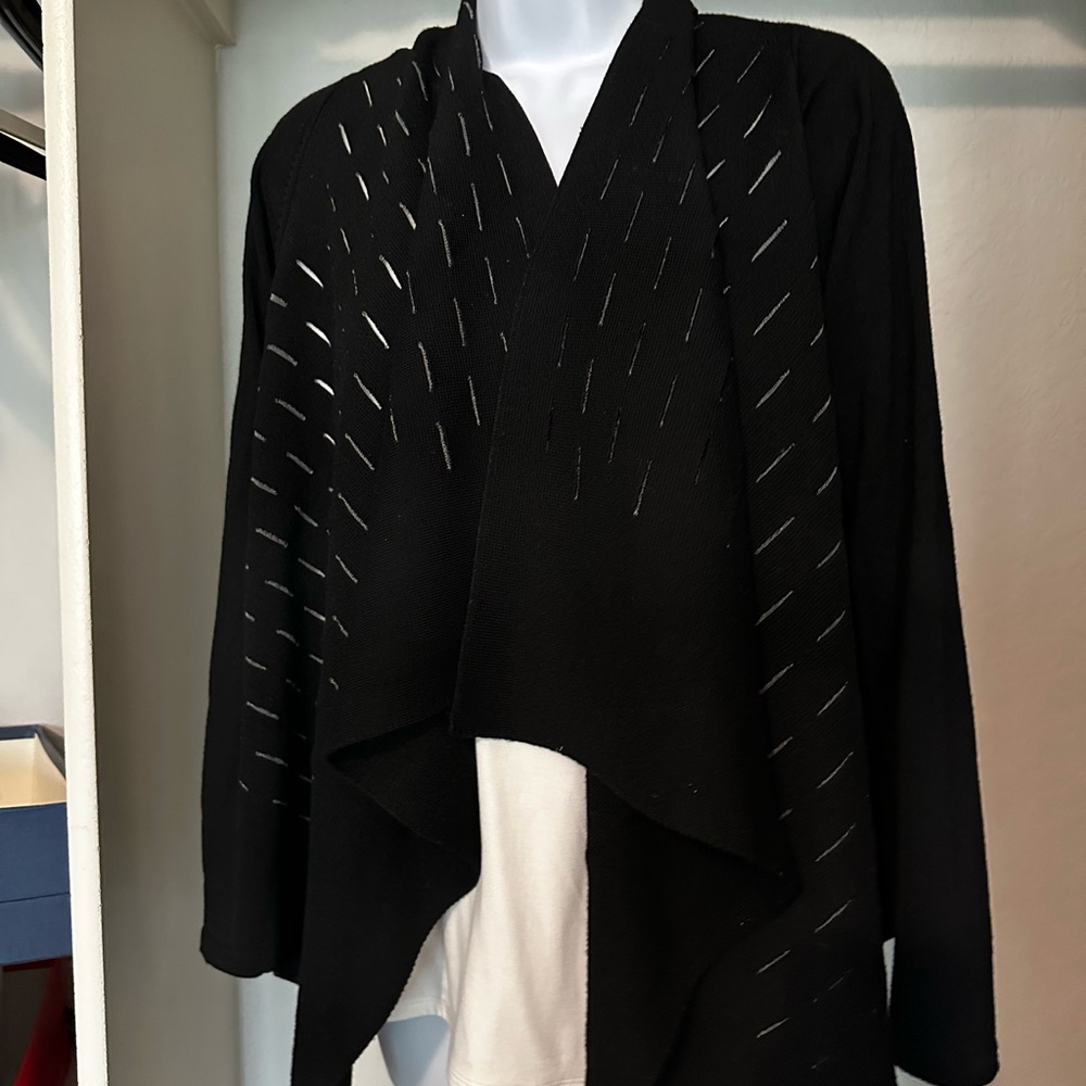 Elie Tahari fine merino wool sweater.  Black with white edged cutouts. Small